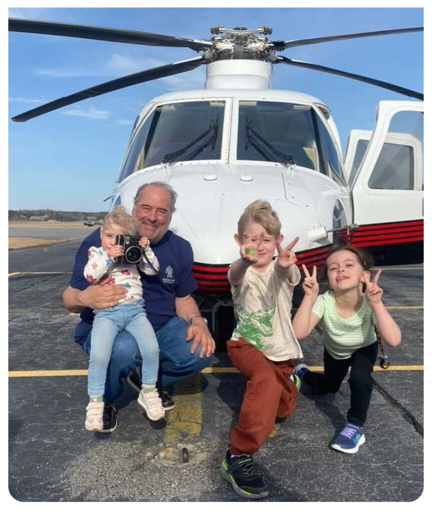 kids in front of a helicopter